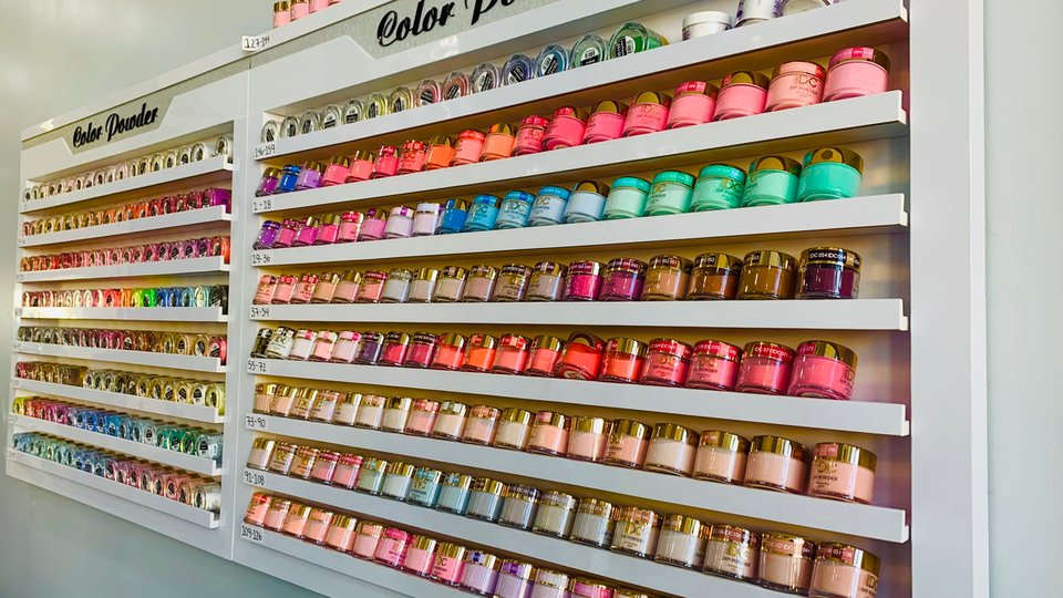 Nail salon interior with manicure stations.